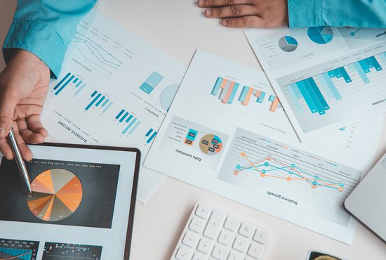 Financial businessman analyze the graph of the company's performance to create profits and growth