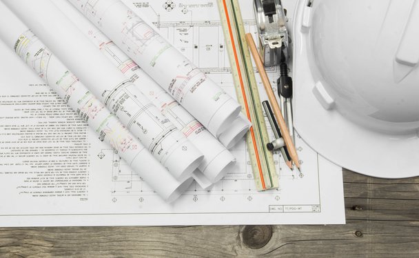 construction helmet, drawings and plans